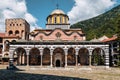 Scenic view of the Rila Monastery against a cloudy blue sky in Bulgaria Royalty Free Stock Photo