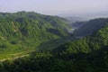 Scenic view of a river flowing in a valley between green mountains in Himachal Pradesh, India Royalty Free Stock Photo