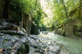 scenic view of river, rocky formations and green plants near Kanto Lampo Waterfall, Royalty Free Stock Photo