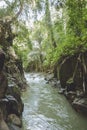 scenic view of river, rocky formations and green plants near Kanto Lampo Waterfall, Royalty Free Stock Photo