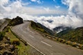 Scenic view of a road on top of an evergreen mountain against a cloudy sky in Madeira, Portugal Royalty Free Stock Photo