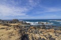 Scenic view of the rocky coastline of Aruba, where Caribbean Sea waves crash against the rocks Royalty Free Stock Photo