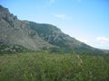 Scenic view of rocky mountains and blue sky on a clear autumn day at the foot of Mount Dimerdzhi, Crimea Royalty Free Stock Photo