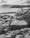 Scenic view of a rocky shoreline of a lake on a cloudy day Royalty Free Stock Photo