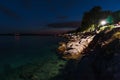 Scenic view of a rocky shoreline of a lake seen during the night Royalty Free Stock Photo