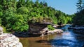 Scenic view of a rocky stream with little cliffs flwing through a spruce forest, Swallow Falls, MD Royalty Free Stock Photo