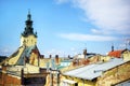 Scenic view of rooftops, old stone and brick walls and catholic church in Lviv, city in western part of Ukraine. Conceptual city Royalty Free Stock Photo