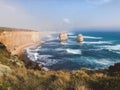 Scenic view of the rugged rocky cliffs and powerful crashing waves