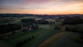 Scenic view of rural houses in green fields of Lausanne, Switzerland at sunset Royalty Free Stock Photo