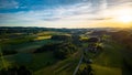 Scenic view of rural houses in green fields of Lausanne, Switzerland at sunset Royalty Free Stock Photo