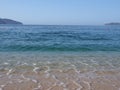 Scenic view of sandy beach at bay landscape of ACAPULCO city in Mexico and waves of Pacific Ocean Royalty Free Stock Photo