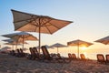 Scenic view of sandy beach with sun beds on the sea and mountains at sunset. Amara Dols Vita Luxury Hotel. Resort Royalty Free Stock Photo