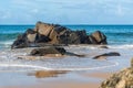 Scenic view of sandy Farol da Barra beach at the shore of Atlantic ocean in Salvador, Bahia, Brazil Royalty Free Stock Photo
