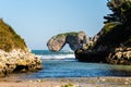 Scenic view of sea against blue sky in rocky coast