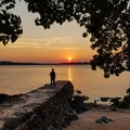 Scenic view of sea against sunset sky