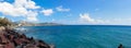 Scenic view of the turquoise sea, red rocks, blue sky, clouds on the island of Santorini, Greece. Greek coast. Royalty Free Stock Photo