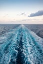 Scenic view of the sea from the stern of a luxurious cruise ship, against the sunrise on a beautiful blue sky Royalty Free Stock Photo