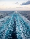 Scenic view of the sea from the stern of a luxurious cruise ship, against the sunrise on a beautiful blue sky Royalty Free Stock Photo