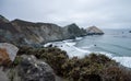 Scenic view of sea waves crashing into Ben Weston Beach under cloudy sky in California Royalty Free Stock Photo