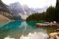 Scenic view of several canoes resting in shallow waters of the Lake Moraine Royalty Free Stock Photo