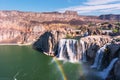 Scenic view of Shoshone Falls waterfall with rainbow on the Snake River under blue sky Royalty Free Stock Photo