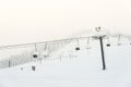 Scenic view of ski lift with over the mountain in ski resort. Royalty Free Stock Photo