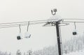 Scenic view of ski lift with over the mountain in ski resort. Royalty Free Stock Photo