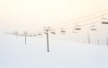 Scenic view of ski lift with over the mountain in ski resort. Royalty Free Stock Photo