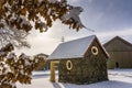 Scenic view of a small house built with cobblestones covered by snow during winter