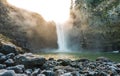 Scenic view of Snoqualmie falls with golden fog when sunrise in the morning. Royalty Free Stock Photo