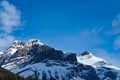 Scenic view of snow covered mountains in Canada with blue sky and shadow from clouds Royalty Free Stock Photo