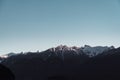 Scenic view of snowcap mountains on blue sky background on Vancouver Island, Canada Royalty Free Stock Photo