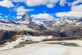 Scenic view on snowy Matterhorn mountain peak in the Swiss Alps with cogwheel train of Gornergrat railway, Zermatt, Royalty Free Stock Photo