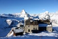 Scenic view on snowy Matterhorn peak in sunny day with blue sky and some clouds in background Royalty Free Stock Photo