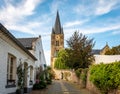 Scenic view of a St Michael abbey church in a white village Limburg, The Netherlands