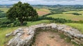 Stone Wall Overlook with Rolling Hills and Lush Tree in the Dist Royalty Free Stock Photo