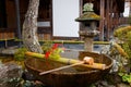 Scenic view of a stone washbowl Chouzubachi or Tsukubai and a stone lantern Royalty Free Stock Photo