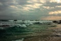 Scenic view, storm during sunset, wild waves and fishermen on srilanka Royalty Free Stock Photo