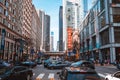 Scenic view of the streets of Chicago filled with people and cars during the day