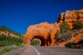 Scenic view of stunning red sandstone natural bridge and asphalt road in Bryce Canyon National Park in Utah Royalty Free Stock Photo