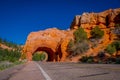 Scenic view of stunning red sandstone natural bridge and asphalt road in Bryce Canyon National Park in Utah Royalty Free Stock Photo