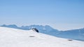 Scenic view on summit cross of mountain Grosser Sauofen in winter on Saualpe. Mountain ranges of Karawanks, Kamnik Savinja Alps