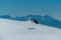 Scenic view on summit cross of mountain Grosser Sauofen in winter on Saualpe. Mountain ranges of Karawanks, Kamnik Savinja Alps