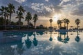 Scenic view of swimming pool by swimming pool against sky during sunset