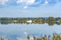 Scenic view to Altmuehl river in Bavaria with tourist ship on pier and reflection of coastline Royalty Free Stock Photo