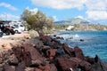 Scenic view of the turquoise sea, red rocks, blue sky, clouds on the island of Santorini, Greece. Greek coast. Royalty Free Stock Photo