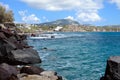 Scenic view of the turquoise sea, red rocks, blue sky, clouds on the island of Santorini, Greece. Greek coast. Royalty Free Stock Photo