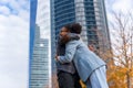 Scenic view of two multi-ethnic businesswomen hugging each other outside of the office Royalty Free Stock Photo