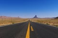 Scenic view of the US highway 163 leading to the Monument Valley with sandstone buttes on the background Royalty Free Stock Photo