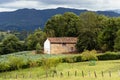 Scenic view of valley in Asturias with traditional farm building